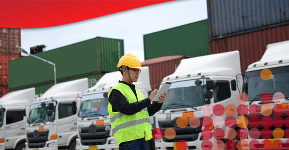 Logistics worker using innovative fleet management ideas to maintain vehicles.